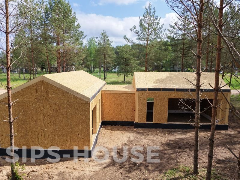 Finished exterior of the 107 m² L-shaped SIPS house kit