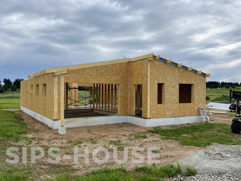 SIPS home with structural wall and roof panels during the assembly process sip homes